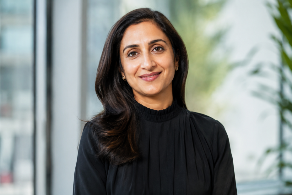 Kavya Pichai in a professional portrait wearing a modest black high-neck outfit.